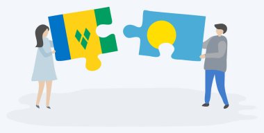 Vincentian ve Palauan bayrakları ile iki bulmaca parçaları tutan çift. Saint Vincent ve Grenadinler ve Palau ulusal sembolleri birlikte.