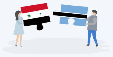 Suriye ve Motsvana bayrakları ile iki bulmaca parçaları tutan çift. Suriye ve Botsvana ulusal sembolleri birlikte.