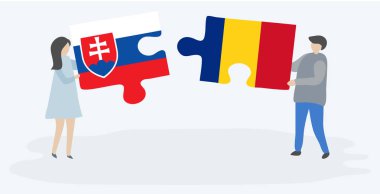 Slovak ve Romen bayrakları ile iki bulmaca parçaları tutan çift. Slovakya ve Romanya ulusal sembolleri bir arada.