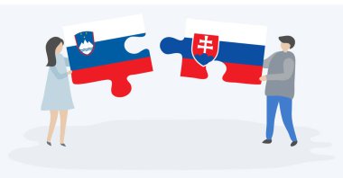 Sloven ve Slovak bayrakları ile iki bulmaca parçaları tutan çift. Slovenya ve Slovakya ulusal sembolleri bir arada.