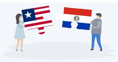 Liberya ve Paraguay bayrakları ile iki bulmaca parçaları tutan çift. Liberya ve Paraguay ulusal sembolleri birlikte.