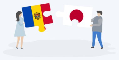 Moldova ve Japon bayrakları ile iki bulmaca parçaları tutan çift. Moldova ve Japonya ulusal sembolleri birlikte.