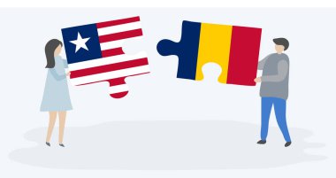 Liberya ve Chadian bayrakları ile iki bulmaca parçaları tutan çift. Liberya ve Çad ulusal sembolleri birlikte.