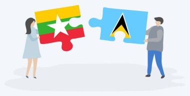 Birmanya ve Saint Lucian bayrakları ile iki bulmaca parçaları tutan çift. Myanmar ve Saint Lucia ulusal sembolleri birlikte.