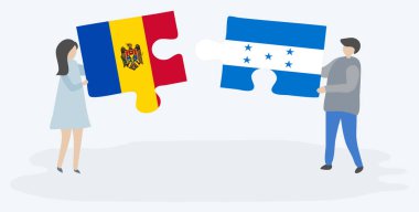 Moldova ve Honduras bayrakları ile iki bulmaca parçaları tutan çift. Moldova ve Honduras ulusal sembolleri birlikte.