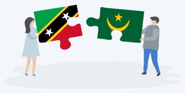 Kittitian ve Moritanya bayrakları ile iki bulmaca parçaları tutan çift. Saint Kitts ve Nevis ve Moritanya ulusal sembolleri birlikte.