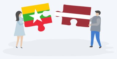 Birmanya ve Leton bayrakları ile iki bulmaca parçaları tutan çift. Myanmar ve Letonya ulusal sembolleri birlikte.