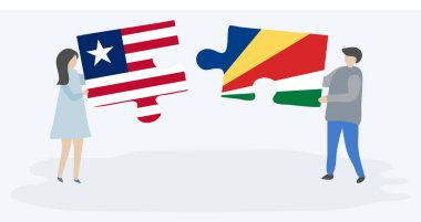 Liberya ve Seychellois bayrakları ile iki bulmaca parçaları tutan çift. Liberya ve Seyşeller ulusal sembolleri birlikte.