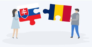 Slovak ve Chadian bayrakları ile iki bulmaca parçaları tutan çift. Slovakya ve Çad ulusal sembolleri birlikte.