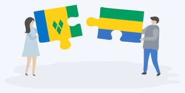 Vincentian ve Gabonese bayrakları ile iki bulmaca parçaları tutan çift. Saint Vincent ve Grenadinler ve Gabon ulusal sembolleri birlikte.