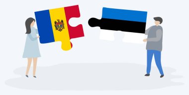 Moldova ve Estonya bayraklarıyla iki bulmaca tutan çift. Moldova ve Estonya ulusal sembolleri birlikte.