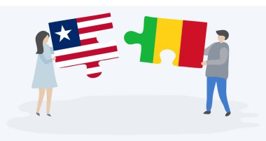 Liberya ve Mali bayrakları ile iki bulmaca parçaları tutan çift. Liberya ve Mali ulusal sembolleri birlikte.