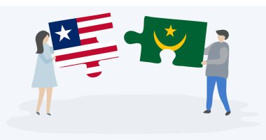 Liberya ve Moritanya bayrakları ile iki bulmaca parçaları tutan çift. Liberya ve Moritanya ulusal sembolleri birlikte.