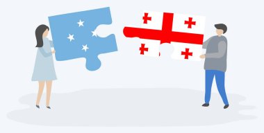 Mikronezya ve Gürcü bayrakları ile iki bulmaca parçaları tutan çift. Mikronezya ve Gürcistan ulusal sembolleri birlikte.