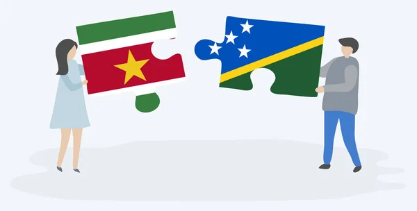 Surinam Solomon Adası Bayrakları Ile Iki Bulmaca Parçaları Tutan Çift — Stok Vektör