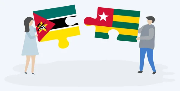 Couple Tenant Deux Pièces Puzzles Avec Drapeaux Mozambicain Togolais Mozambique — Image vectorielle