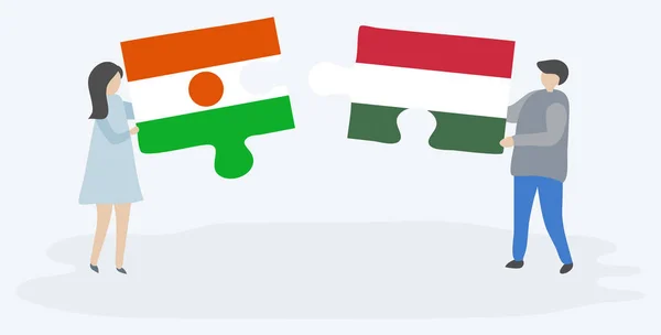 Ζευγάρι Που Κρατά Δύο Κομμάτια Παζλ Τις Σημαίες Του Νιγηριάν — Διανυσματικό Αρχείο