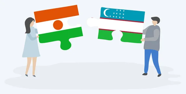 一对夫妇拿着两块拼图 上面挂着尼日尔和乌兹别克国旗 尼日尔和乌兹别克斯坦国家符号在一起 — 图库矢量图片