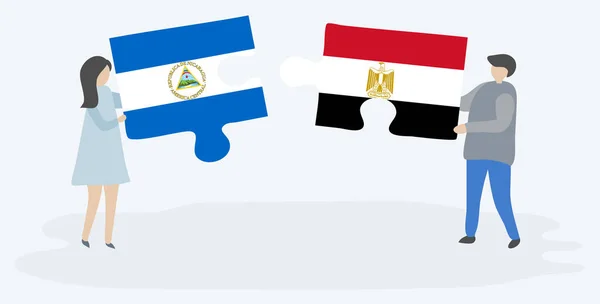 Пара Проведення Двох Головоломок Штук Nicaraguan Єгипетські Прапори Нікарагуа Єгипет — стоковий вектор