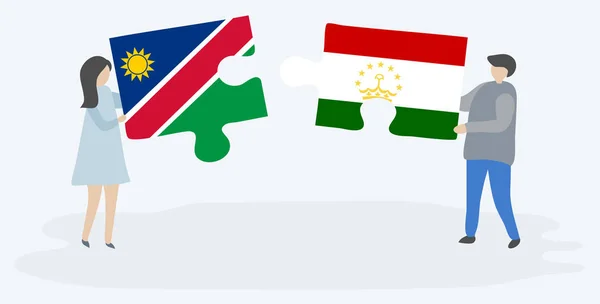 Pareja Sosteniendo Dos Piezas Rompecabezas Con Banderas Namibia Tayikistán Namibia — Vector de stock