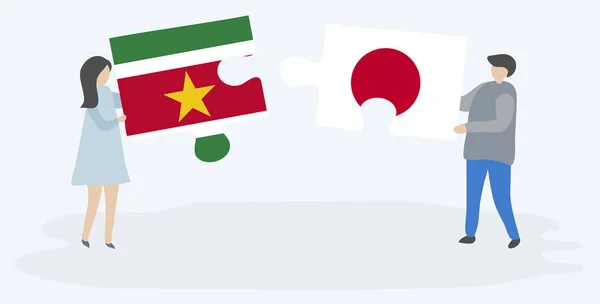 Dvojice Drží Dvě Skládanky Surinamským Japonskými Vlajkami Národní Symboly Surinamu — Stockový vektor