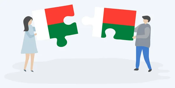 Paar Mit Zwei Puzzleteilen Mit Madagassischen Und Madagassischen Flaggen Madagaskar — Stockvektor