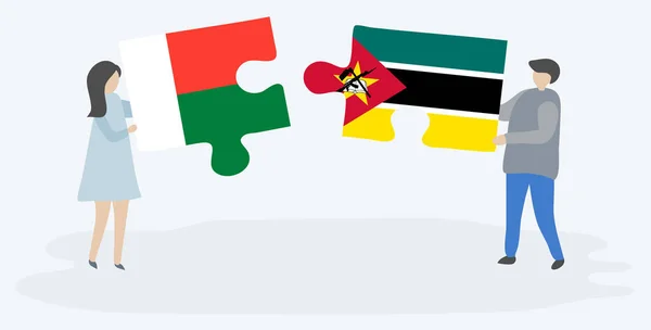 Couple Tenant Deux Pièces Puzzles Avec Des Drapeaux Malgaches Mozambicains — Image vectorielle