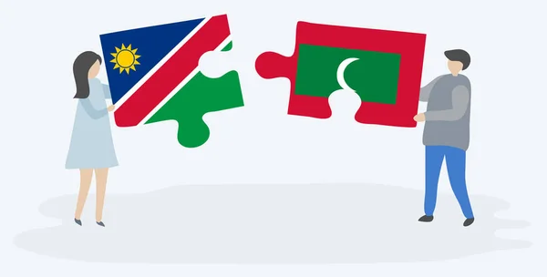 Pareja Sosteniendo Dos Piezas Rompecabezas Con Banderas Namibia Maldivas Namibia — Vector de stock