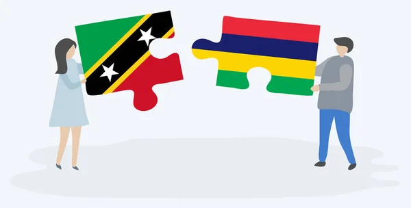 Casal Segurando Duas Peças Quebra Cabeças Com Bandeiras Kittitian Mauritian — Vetor de Stock
