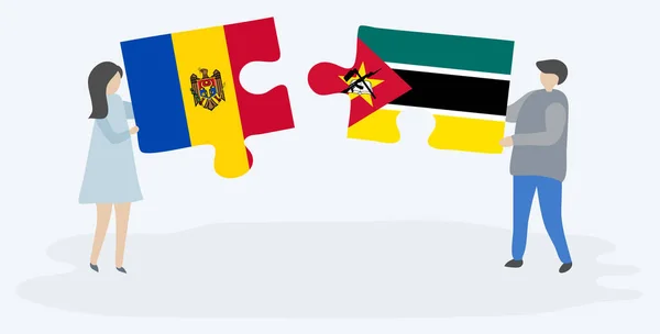 Pareja Sosteniendo Dos Piezas Rompecabezas Con Banderas Moldavas Mozambiqueñas Moldavia — Vector de stock