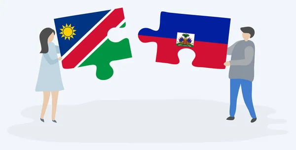 Pareja Sosteniendo Dos Piezas Rompecabezas Con Banderas Namibia Haití Namibia — Vector de stock