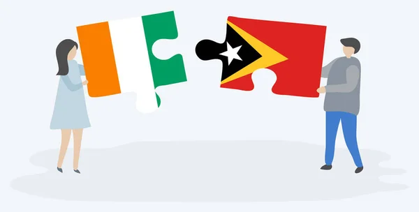 Пара Держащая Две Головоломки Ивуарийскими Тиморскими Флагами Кот Ивуар Восточный — стоковый вектор