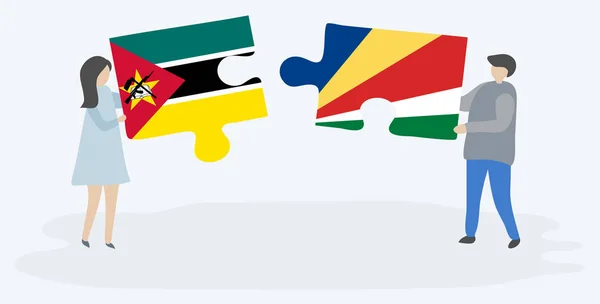 Couple Tenant Deux Pièces Puzzles Avec Des Drapeaux Mozambicains Seychellois — Image vectorielle