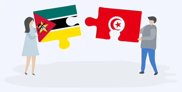 Casal Segurando Duas Peças Quebra Cabeças Com Bandeiras Moçambicanas Tunisinas —  Vetores de Stock