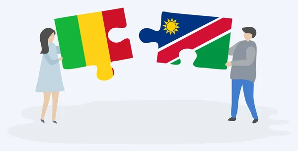 Casal Segurando Duas Peças Quebra Cabeças Com Bandeiras Malianas Namibianas — Vetor de Stock