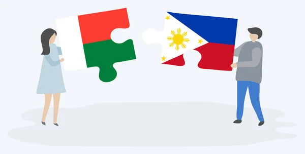 Par Som Innehar Två Pusselbitar Med Malagassiska Och Filippinska Flaggor — Stock vektor