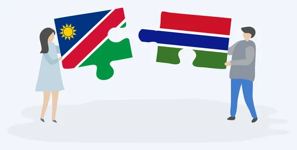 Pareja Sosteniendo Dos Piezas Rompecabezas Con Banderas Namibia Gambia Namibia — Vector de stock