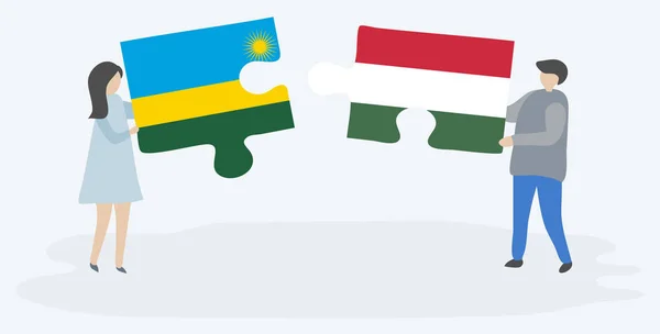 Couple Tenant Deux Pièces Puzzles Avec Des Drapeaux Rwandais Hongrois — Image vectorielle