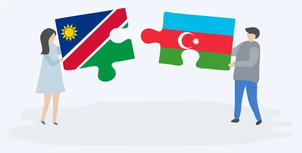 Pareja Sosteniendo Dos Piezas Rompecabezas Con Banderas Namibia Azerbaiyán Namibia — Vector de stock