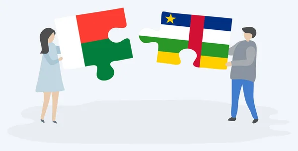 Paar Houden Twee Puzzels Stukken Met Malagasi Centraal Afrikaanse Vlaggen — Stockvector