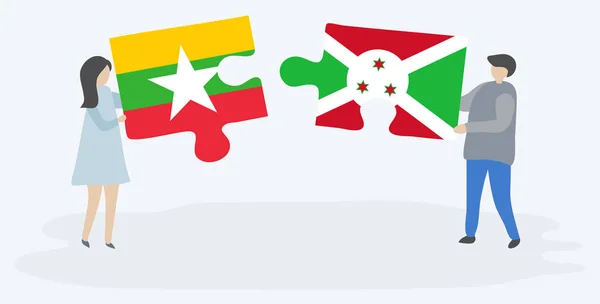 一对夫妇拿着两块拼图 上面挂着缅甸和布隆迪国旗 缅甸和布隆迪国家符号在一起 — 图库矢量图片