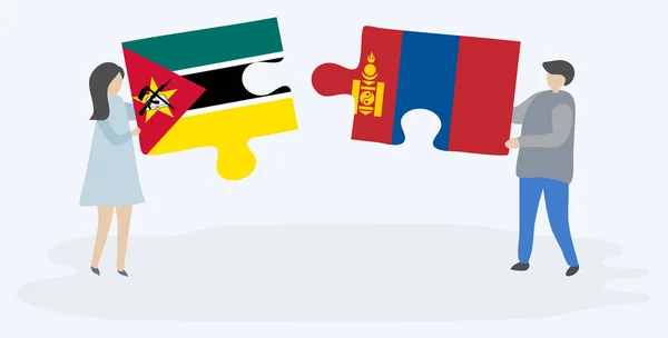 Ζευγάρι Που Κρατά Δύο Κομμάτια Παζλ Τις Σημαίες Της Μοζαμβίκης — Διανυσματικό Αρχείο