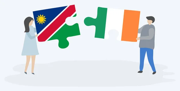 Pareja Sosteniendo Dos Piezas Rompecabezas Con Banderas Namibia Irlanda Namibia — Vector de stock