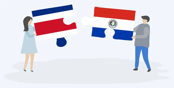 Para Trzyma Dwa Kawałki Puzzli Kostarykańską Flagi Paragwaju Kostaryka Paragwaj — Wektor stockowy