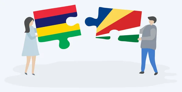 モーリシャスとセイチェロスの旗を持つ2つのパズルピースを保持しているカップル モーリシャスとセーシェルの国のシンボルが一緒に — ストックベクタ