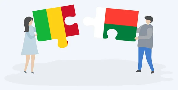 Paar Houden Twee Puzzels Stukken Met Malian Malagasy Vlaggen Mali — Stockvector