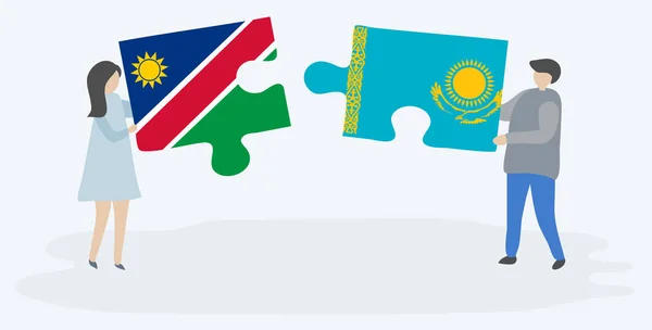 Pareja Sosteniendo Dos Piezas Rompecabezas Con Banderas Namibia Kazajstán Namibia — Vector de stock