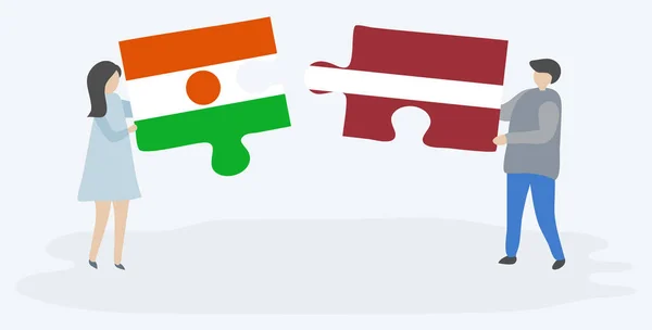 Paar Mit Zwei Puzzleteilen Mit Nigerianischen Und Lettischen Flaggen Nationale — Stockvektor