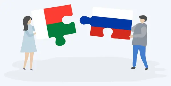 Ζευγάρι Που Κρατάει Δύο Κομμάτια Παζλ Σημαίες Μαδαγασκάρης Και Ρωσικά — Διανυσματικό Αρχείο