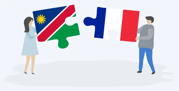 Pareja Sosteniendo Dos Piezas Rompecabezas Con Banderas Namibia Francia Namibia — Vector de stock